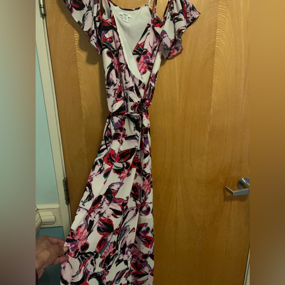 Maxi flora dress by Barr III sleeves hangs off shoulder with spaghetti strep.